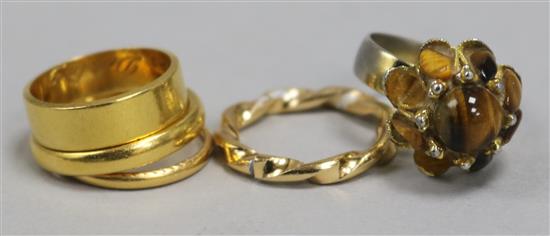 Three 22ct gold gold wedding bands and two other costume rings.